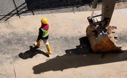 construction worker walking on jobsite